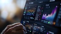 Financial market data visualization with colorful charts and graphs on dark monitor screen, trader analyzing stock market performance and investment trends.