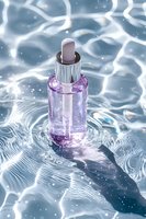 Purple glass dropper bottle with silver cap floating on rippled water surface with light reflections and sparkles, cosmetic product photography for skincare advertising.