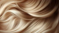 Smooth flowing blonde hair with wavy texture and shiny highlights creating elegant curves and movement. Ideal for beauty and haircare advertising.