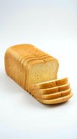 Fresh sliced white bread loaf isolated on white background for bakery and food design projects.