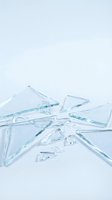 Shattered glass fragments and sharp pieces scattered on white surface, isolated for design use on backgrounds, overlays, and digital compositions.