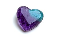 Crystal heart gemstone in purple and turquoise colors with translucent effect on white background, suitable for jewelry design and romantic concepts.