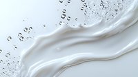 Smooth white cream wave with water drops on light background, luxury cosmetic texture, flowing milk splash for skincare and beauty product advertising.