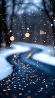 Magical winter evening with falling snow and golden bokeh lights on dark road. Blurred forest background creates dreamy atmosphere for seasonal greeting cards.