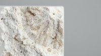 Organic wheat flour texture with natural grains and particles, perfect for baking, cooking and food preparation backgrounds.