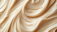 Smooth flowing cream-colored swirls create luxurious abstract waves and curves in soft beige and ivory tones, suggesting silky texture and gentle movement. For beauty and cosmetic designs.