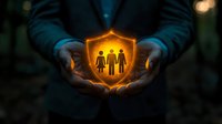Glowing golden shield with family silhouettes held in protective hands against dark background, representing security, protection and family care concept.