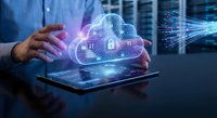 Businessman using tablet with holographic cloud computing security interface showing digital locks and data protection technology in modern office.