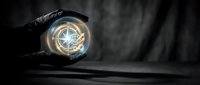Hand in black glove holding glowing compass with golden light against dark background for navigation and direction concepts in business presentations.