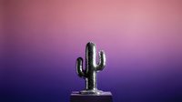 Metallic silver cactus sculpture on platform against vibrant purple pink gradient background for modern decor and design projects.