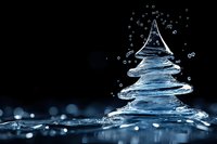 Water splash forming Christmas tree shape with droplets on dark blue background for holiday marketing and seasonal campaigns.