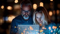Mature Caucasian couple illuminated by glowing digital tablet screen at night, bokeh lights background creates magical atmosphere for technology concept.