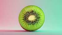 Fresh kiwi fruit slice showing vibrant green flesh and black seeds on colorful gradient background for healthy eating and nutrition concepts.
