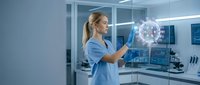 Young blonde female scientist in blue lab coat interacting with holographic molecular structure in modern laboratory for medical research and technology.