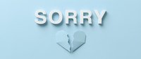 Sorry text with paper broken heart on light blue background, concept of apology, forgiveness, and relationship healing.