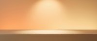 Warm golden orange gradient background with soft lighting effect creating elegant minimalist display surface for product presentation and design projects.