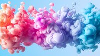 Vibrant colorful ink drops in water creating abstract fluid art with smooth transitions from orange to pink, purple and blue tones against light background.