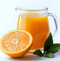 Fresh orange juice in glass pitcher with halved citrus fruit and green leaves on white background, bright natural beverage photography for menu design.