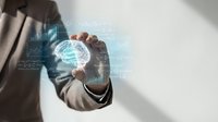 Businessman in suit holding glowing digital globe with data analytics charts and network connections, representing global business, technology innovation, and worldwide commerce.