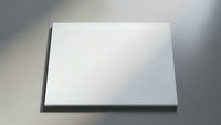 Clean white blank canvas board on neutral surface ready for artistic projects and creative presentations.