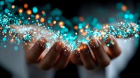 Female hands holding magical sparkling light particles in turquoise and orange colors against dark background, creating mystical atmosphere for spiritual concepts.
