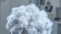 Fluffy white cotton ball close-up with soft texture, suitable for healthcare, textile, hygiene, and product packaging design projects.