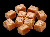 Caramel candy cubes isolated on transparent background, ready for design use on t-shirts, stickers, clipart, print-on-demand products, and sublimation projects.