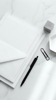 Minimalist white office workspace with blank papers, black pen, paper clip, concrete cube and coffee cup on marble surface for business branding mockup.