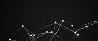 Abstract network connections with glowing nodes and lines on dark background for technology and data visualization concepts.