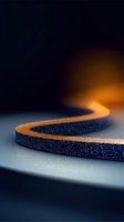 Curved dark textured path with glowing orange light trail creating dramatic contrast against black background, abstract minimal composition for technology designs.