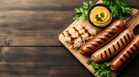 Grilled sausages with mustard sauce on wooden cutting board, garnished with fresh parsley. Dark rustic background with copy space for menu or recipe.