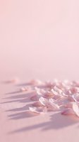 Soft pink rose petals scattered on wooden surface with dreamy pastel background for romantic wedding and spa concepts.