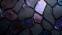 Dark geometric mosaic pattern with iridescent purple and blue metallic highlights on black stone texture, creating dramatic light effects and modern abstract design.