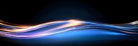Glowing blue and orange light waves flowing smoothly across dark background create dynamic motion effect for technology and communication designs.