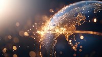 Glowing world map with illuminated city lights and golden particles against dark background, showing global connectivity and international network concept.