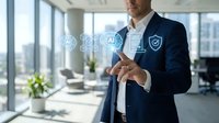 Professional businessman in navy suit touching digital security icons in modern office environment representing cybersecurity and data protection solutions.