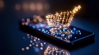 Glowing shopping cart icon floating above smartphone screen with sparkles and bokeh lights in dark blue atmosphere, concept of mobile commerce and digital retail.