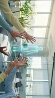 Business professionals using holographic human body projection technology in modern office environment for medical or healthcare presentation and collaboration.