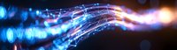 Abstract glowing blue and pink light trails with bokeh effect creating dynamic wave pattern against dark background, modern technology concept.