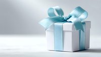 Elegant white gift box with turquoise blue satin ribbon bow on light background, perfect for celebrations, holidays, and special occasions.
