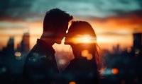 Romantic silhouette of young couple against urban sunset skyline with golden light and bokeh effect creating intimate atmosphere. Perfect for Valentine's day designs.
