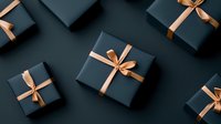 Dark green gift boxes with elegant copper satin ribbons and bows arranged on moody background. Luxury present wrapping for special occasions and holidays.