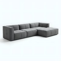 Modern modular gray sectional sofa with chaise lounge on white background, featuring tufted cushions and clean geometric lines for contemporary living spaces.