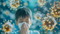 Young Asian boy wearing protective face mask sneezing with virus particles floating in turquoise blue background, concept of respiratory illness and infection.