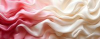 Smooth gradient waves of pink and cream colored silk fabric creating soft flowing curves and elegant folds in panoramic composition. Luxury textile background.