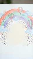 Watercolor rainbow with hot air balloons and clouds frame, decorative border with stars and floral elements for baby shower invitations and nursery decor.