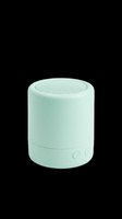 Mint green compact wireless bluetooth speaker isolated on transparent background, cut out for stickers, print on demand, T-shirt design, and clipart use.