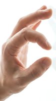 Close-up of an open male hand with fingers spread wide, isolated on white background, suitable for healthcare, business, and communication design projects.