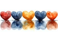 Colorful heart shapes in red, blue, orange arranged in row with reflection on white surface, romantic love concept for Valentine's Day and celebrations.