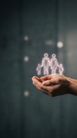 Hands holding glowing family icons representing protection, care and insurance coverage with soft bokeh background for financial security concepts.